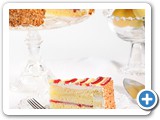 Lemon Raspberry Cake
Two layers of moist vanilla cake filled with raspberry and lemon. Iced with a smooth vanilla cream and garnished with praline nuts. Light and Refreshing!
