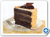 Chocolate Peanut Butter cake
Three layers of pure chocolate and peanut butter indulgence. Iced with a peanut butter flavored mousse and finished with a Reese’s peanut butter cup on each slice.
